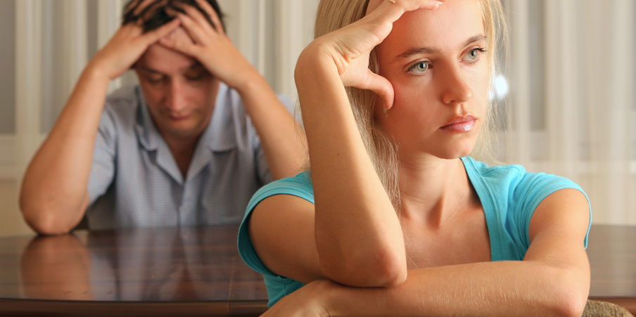 man-and-woman-sitting-at-table-not-talking